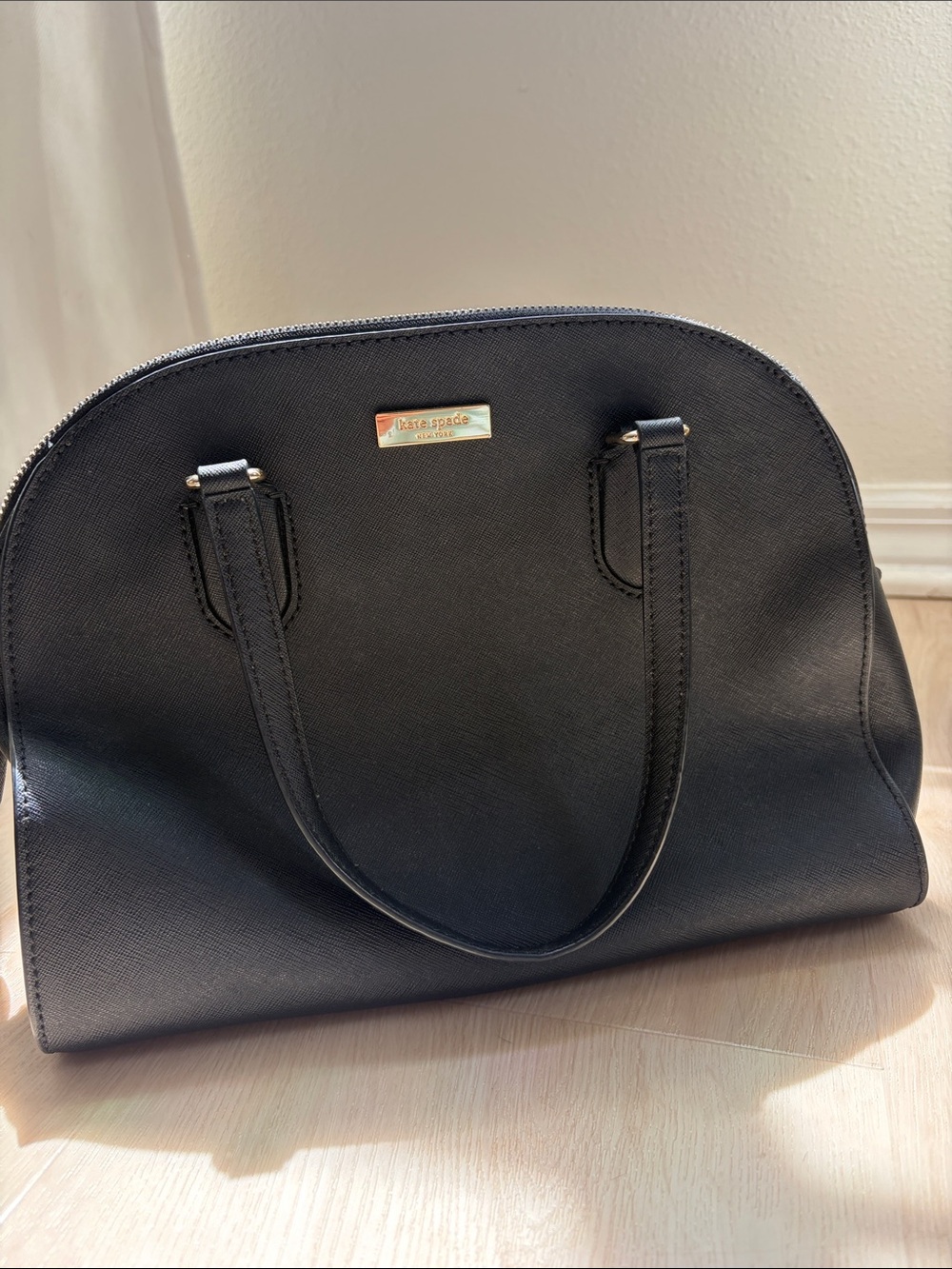 kate spade black dome satchel with gold hardware and crossbody strap